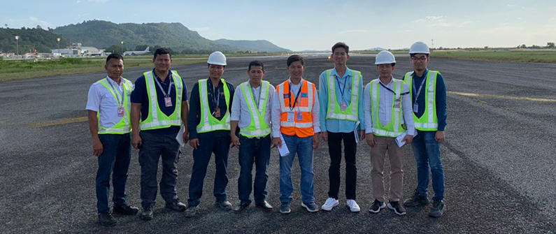 Members of the ground crew take a break from inspections to smile with pride about their great work.