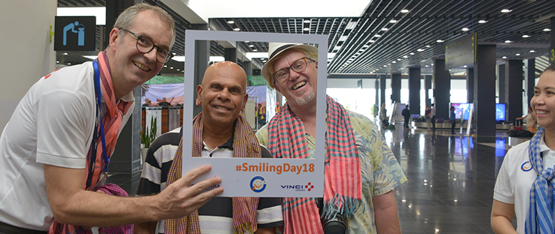 Cambodia Airports CEO Eric Delobel welcomes tourists arriving at Siem Reap International Airport on Smiling Day.